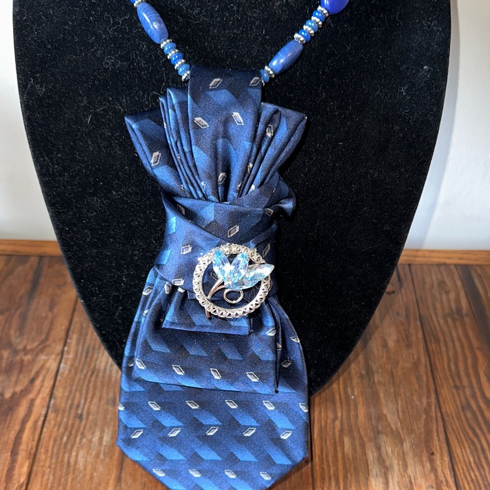 Elegant Vintage Silk Blue Necktie with Beaded Necklace and Vintage Brooch